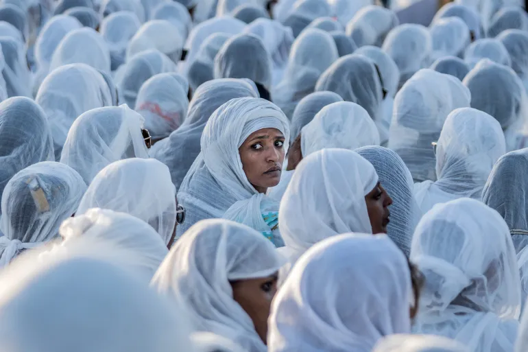 Worshippers gather on the eve of Orthodox Christmas at Meskel Square in Addis Ababa, Ethiopia