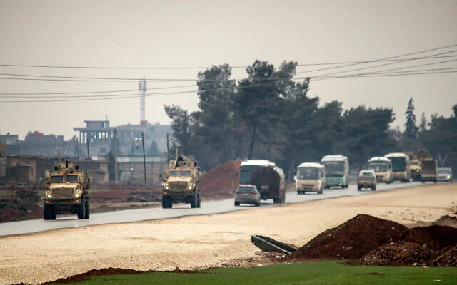 U.S. military convoy transporting ISIS detainees from Syria to Iraq