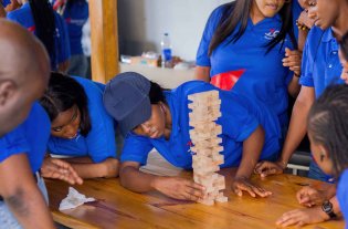 Pharmaceutical manufacturing pharmacist supervising tablet production line in Ogun State