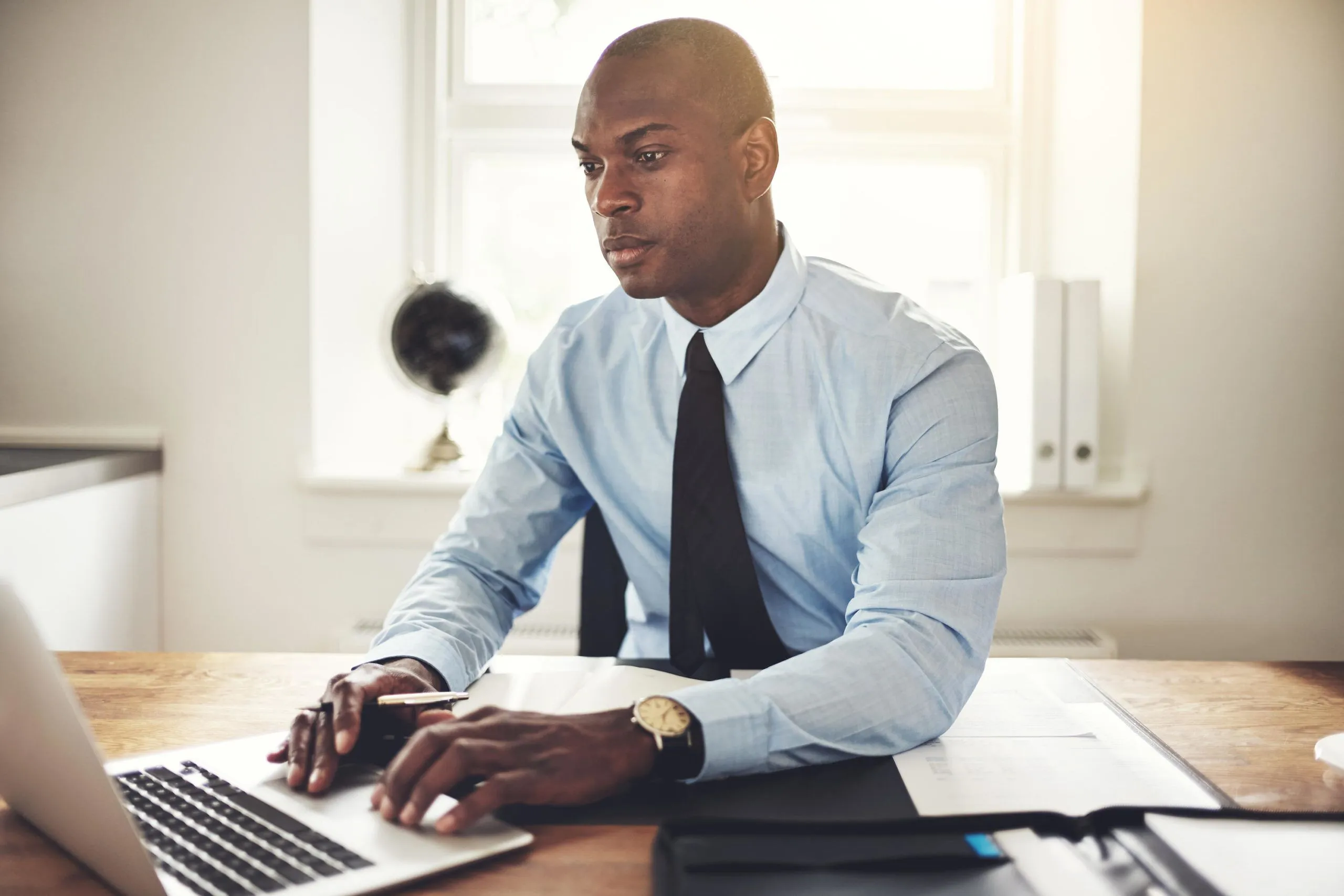 Accountant job Lagos Nigeria ICAN ACCA 2026,Professional accountant reviewing financial reports in Lagos office