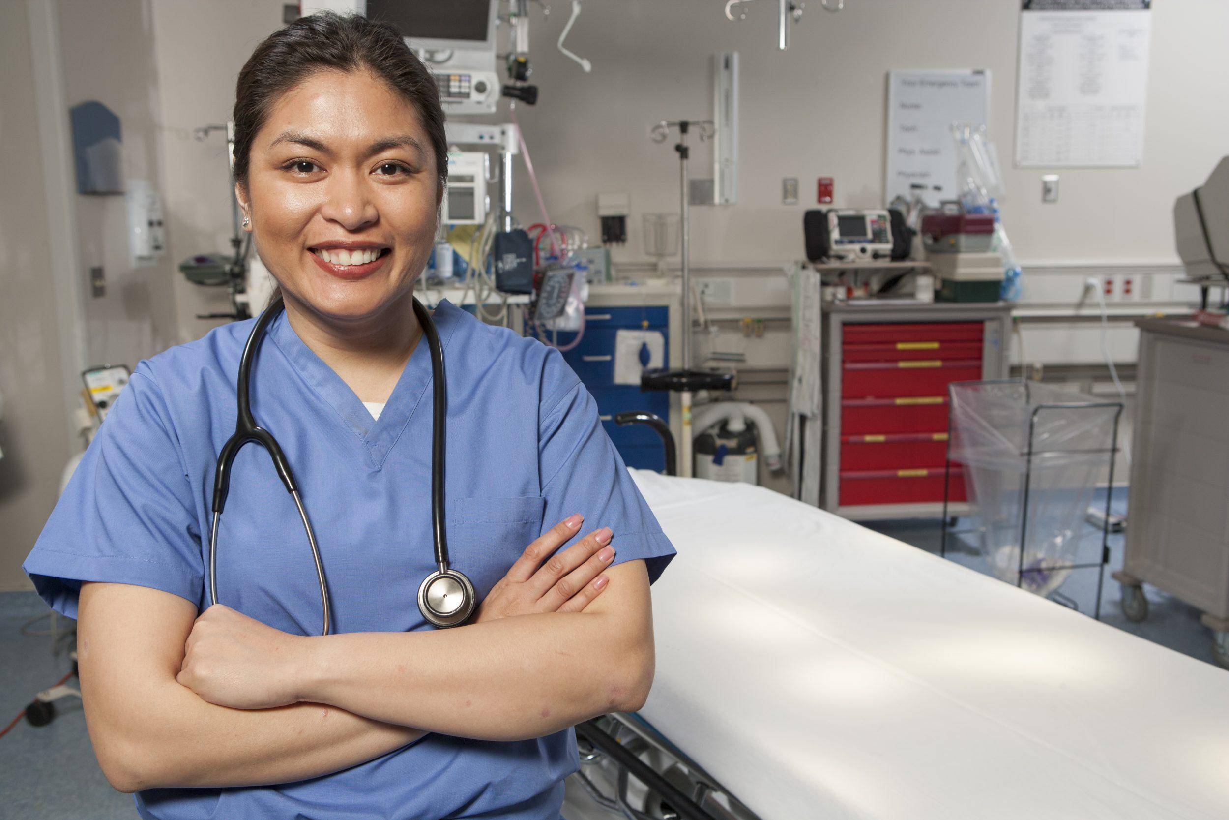 Endoscopy nurse assisting doctors during a medical procedure in a hospital endoscopy unit