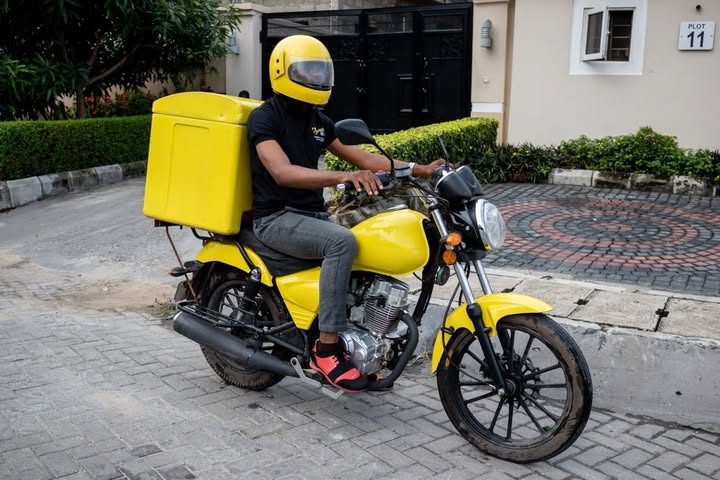 Dispatch rider delivering package using motorcycle