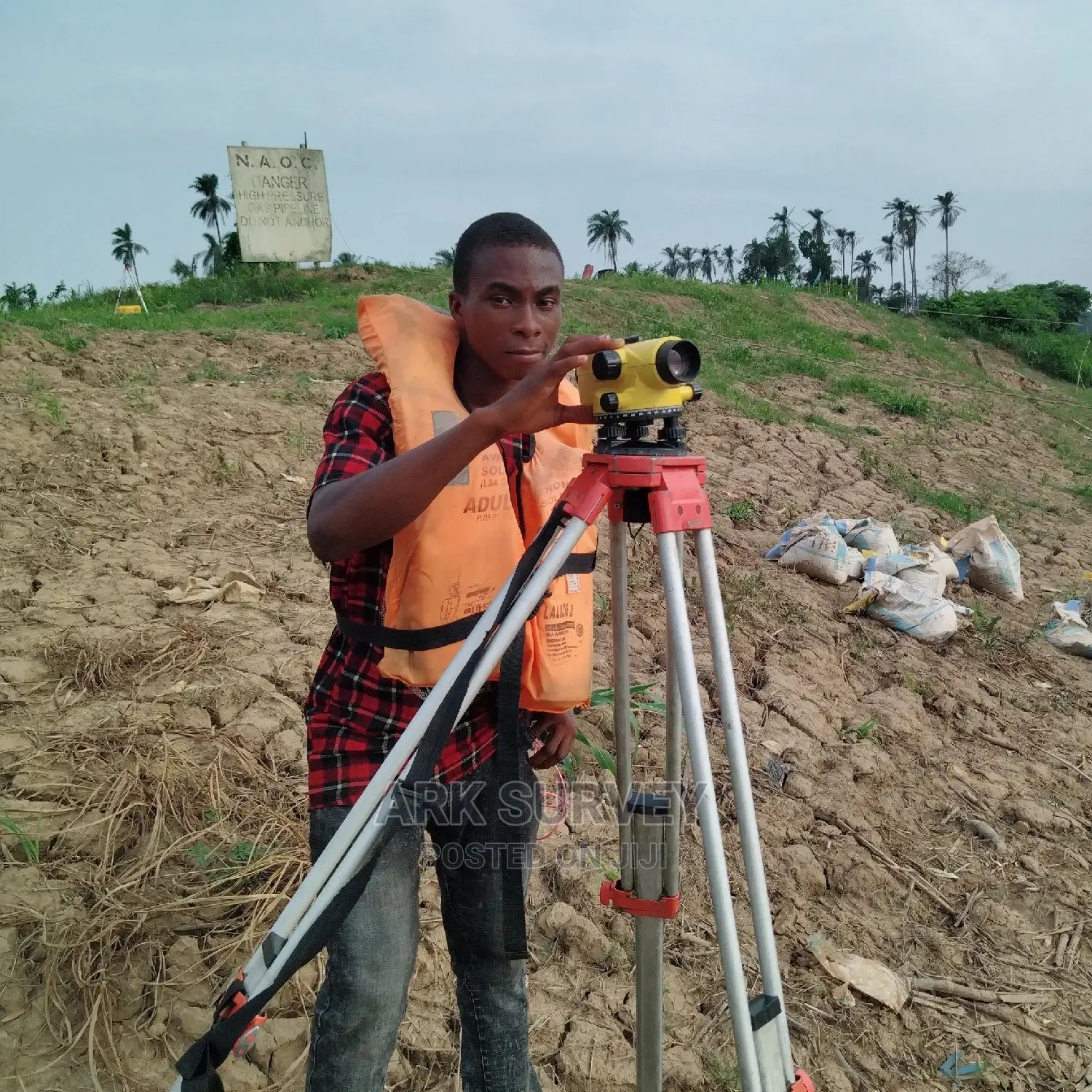 Professional surveyor using GPS and Total Station equipment for land measurement in Ogun State