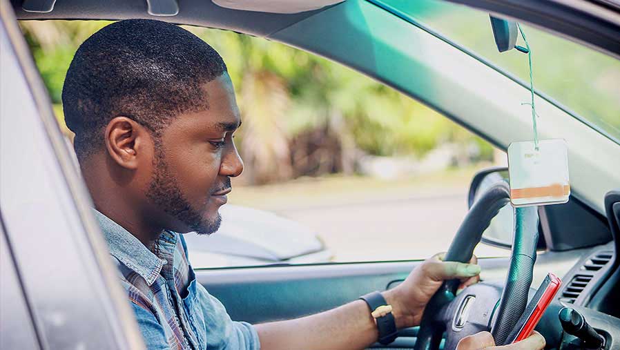 Driver job Abuja Frandek Consulting 2026: Professional driver transporting staff in Abuja city