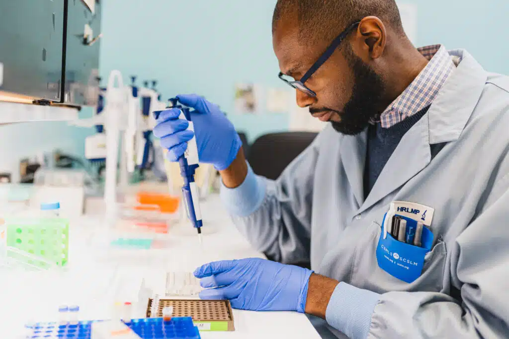 Laboratory technician performing sample analysis in a lab