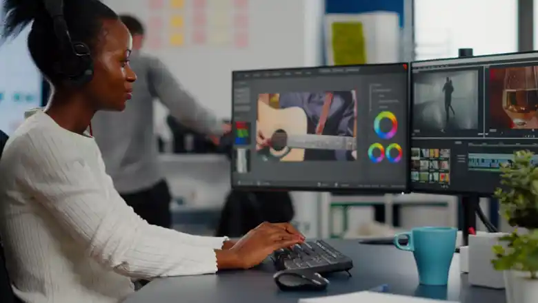 Lekki graphic designer job 2026 working on a computer at business center in lagos