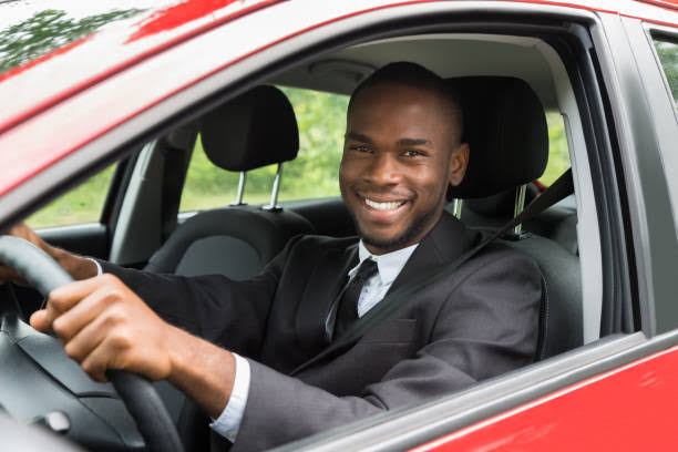 Personal driver preparing vehicle for employer transportation in Lagos
