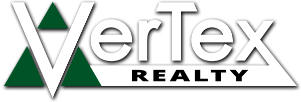 Facility officer coordinating property project activities in a real estate office environment