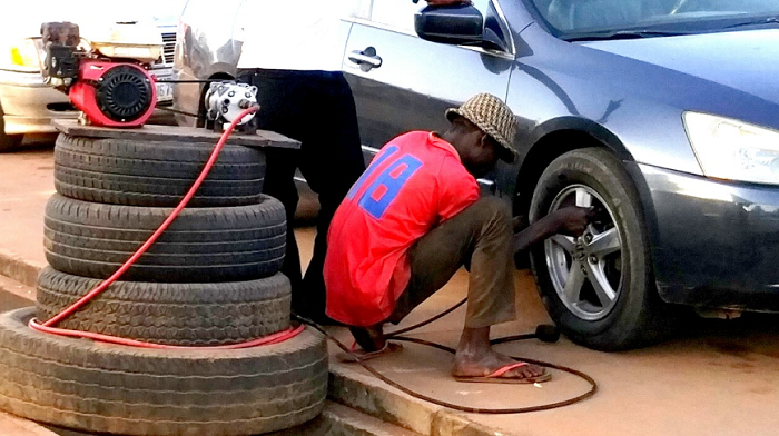 Truck tire vulcanizer repairing heavy duty vehicle tire in Lagos workshop