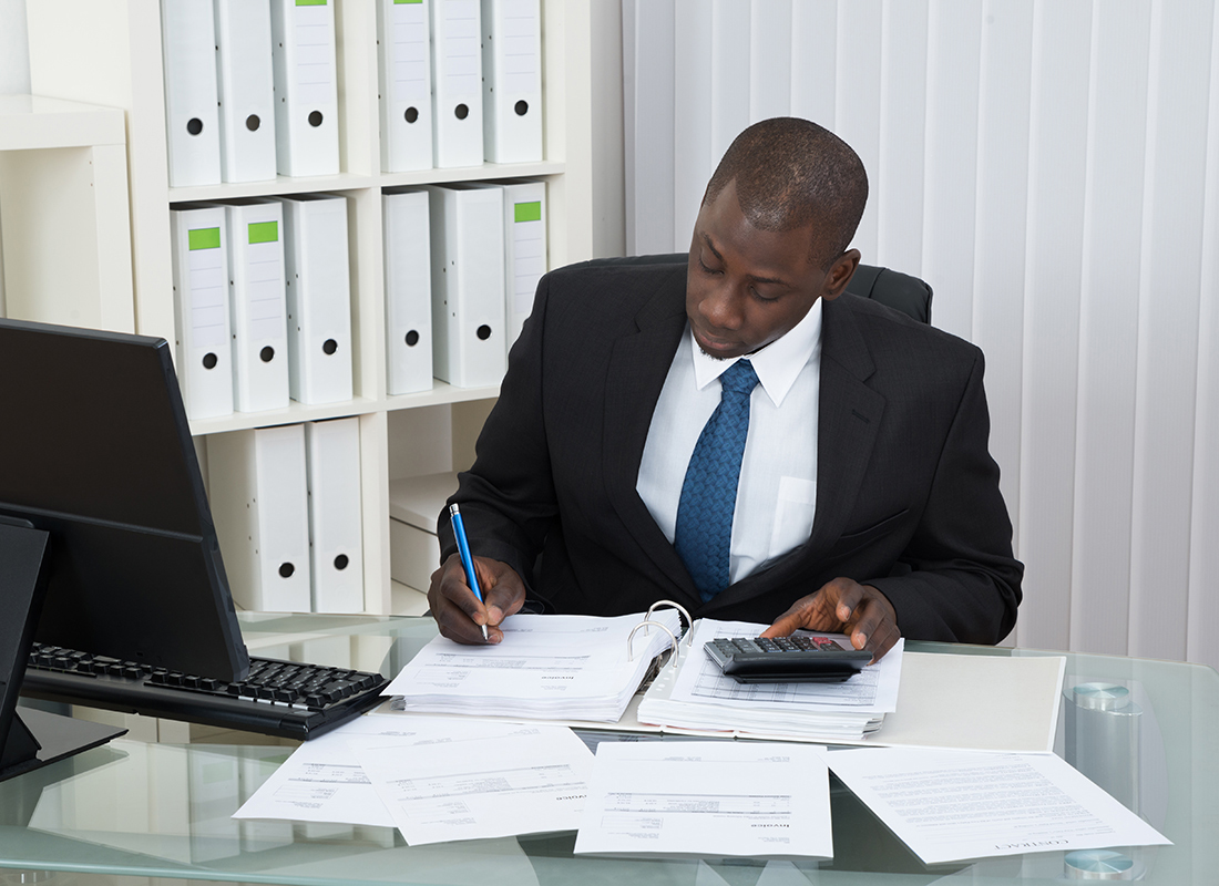 Accountant job Ikoyi Lagos Pesach Global 2026: Accountant reviewing financial reports in Lagos office