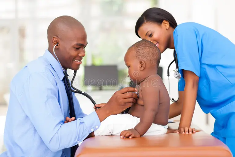 Paediatrician conducting a medical checkup for a child in a hospital clinic