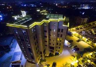 Maintenance manager inspecting building equipment in a facility