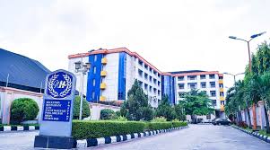 Hotel operations manager supervising hotel front desk and hospitality staff