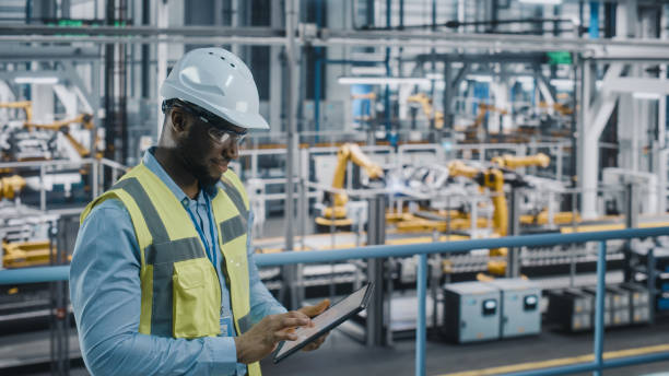 Electrical Manager Power Plant Dangote job 2026: : Electrical engineer inspecting power plant equipment at Dangote facility