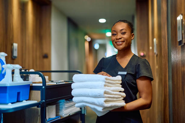Housekeeper cleaning office and maintaining facilities in Lagos