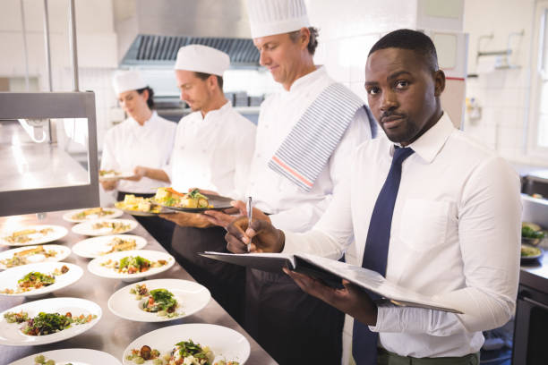Restaurant Supervisor Lagos job 2026: restaurant supervisor managing staff and customer service in a busy Lagos restaurant
