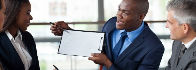 : Sales executive presenting telecom solutions to business clients