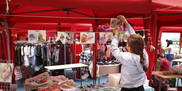 in-shop sales promoter Abuja 2026assisting a customer at a retail store in Abuja