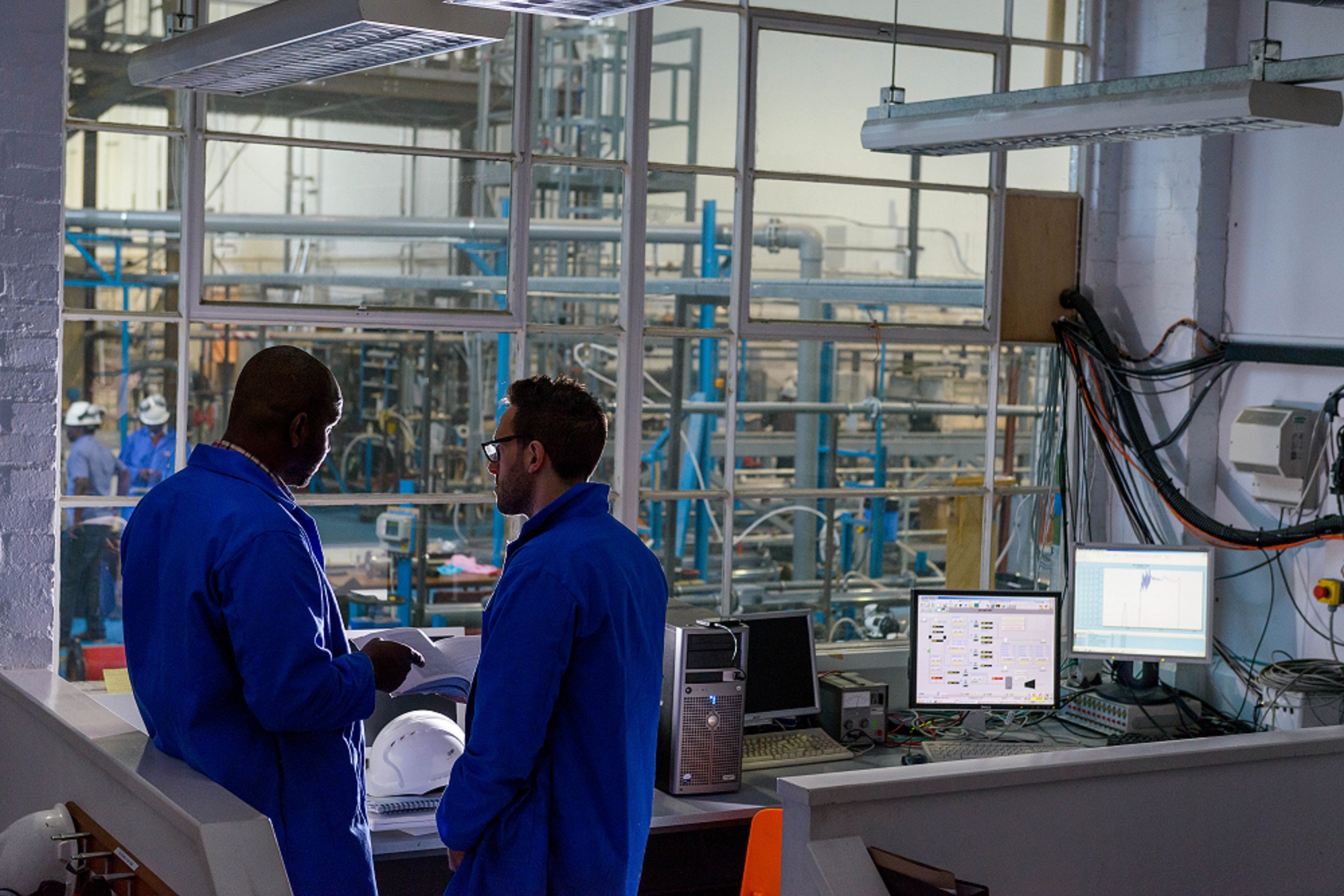 Dangote Process Engineer Job Tanzania working at cement production plant.