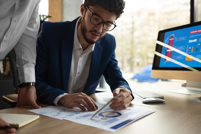 Ecobank Nigeria Finance Officer Job reviewing financial reports at office in Lagos