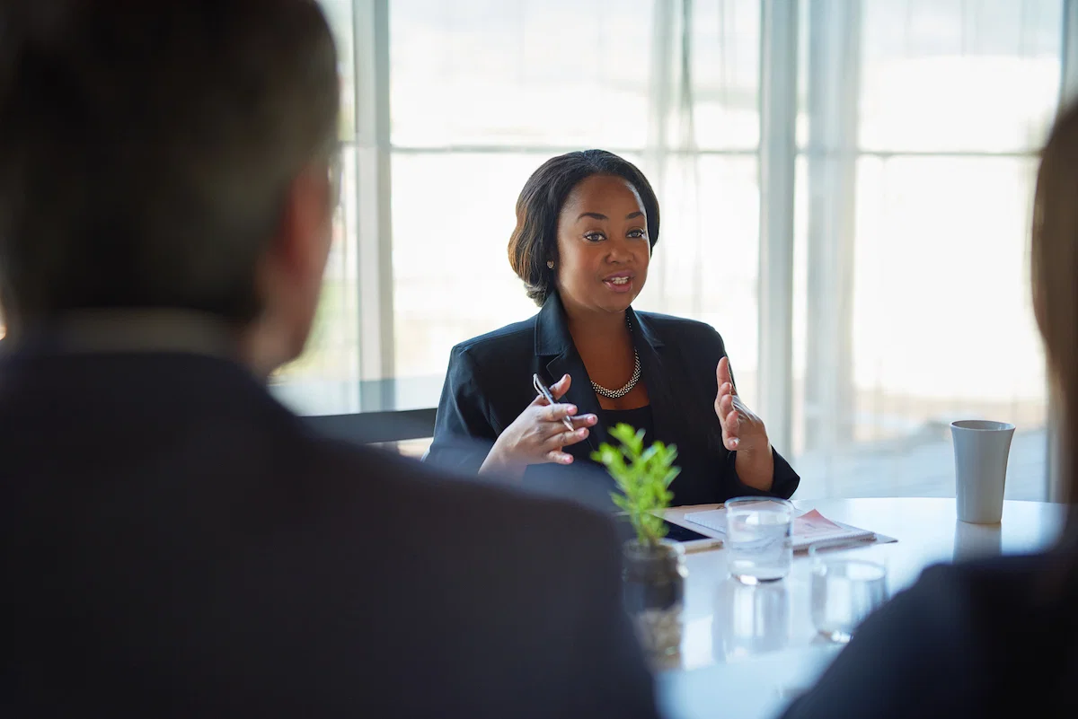 Communications Officer Job Abuja 2026 working on corporate communication strategy in the office