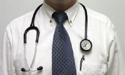 International Medical Corps doctor job examining patient in healthcare facility supported by International Medical Corps Kano Nigeria