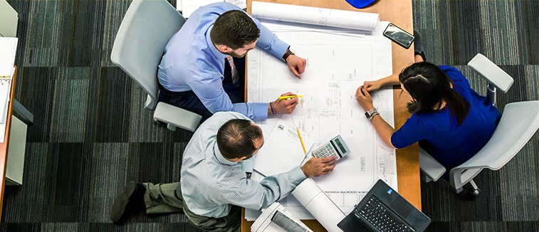 Coca-Cola Civil Engineering Manager Job reviewing industrial plant designs at Hellenic Bottling Company facility