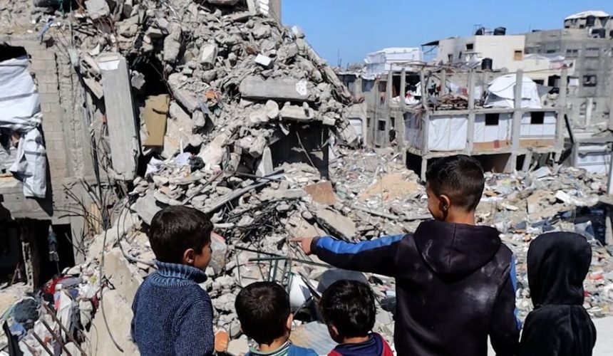 UN Gaza children targeting report showing Palestinian children among destroyed buildings in Gaza