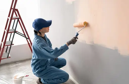 Eko Maintenance painter job Lagos working on building surface at Eko Maintenance facility