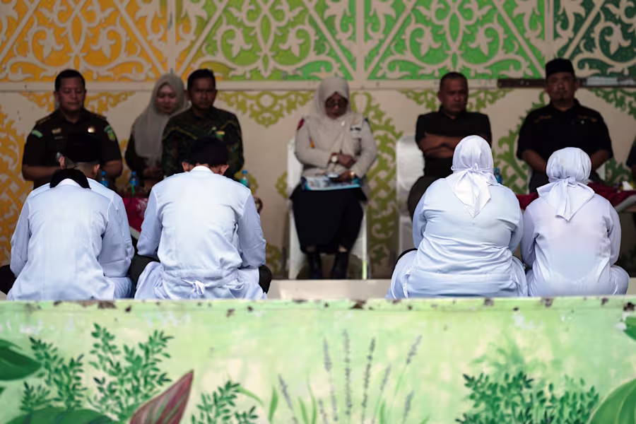 Indonesia couple caned TikTok kissing incident in Aceh province public punishment scene