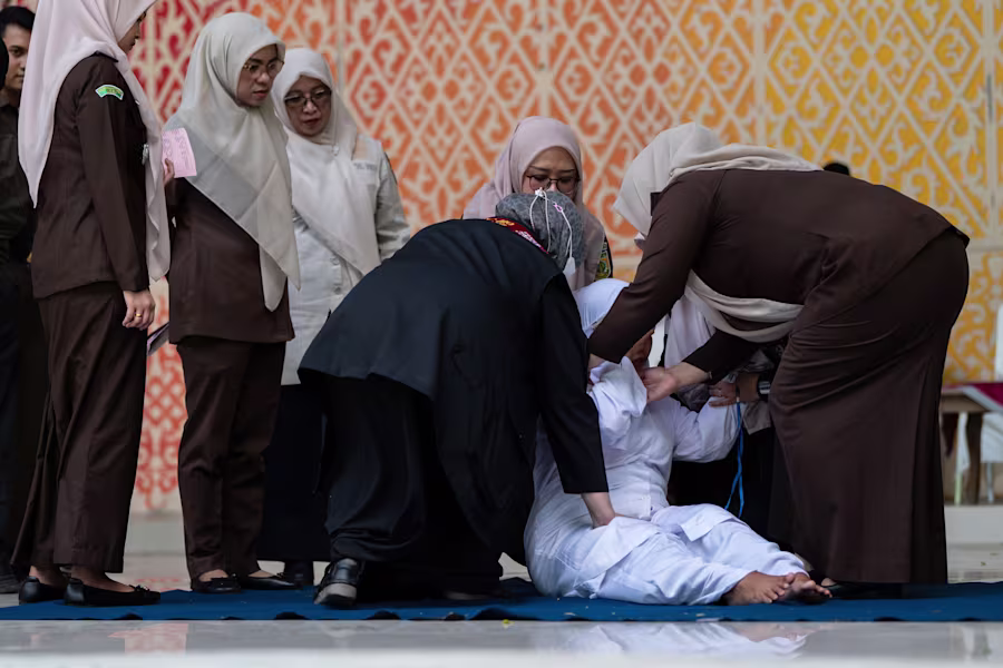 Couple caned for kissing on TikTok in Indonesia's conservative Aceh province