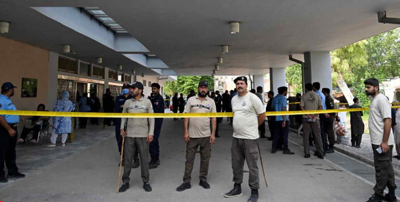 Parents mourn outside PIMS Hospital in Islamabad after a fire in the Mother and Child Health Ward killed 14 newborns.