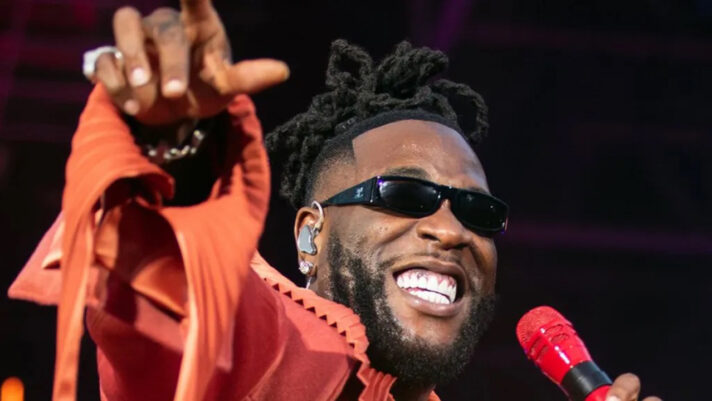 Burna Boy stage crew flame shooter warning during concert