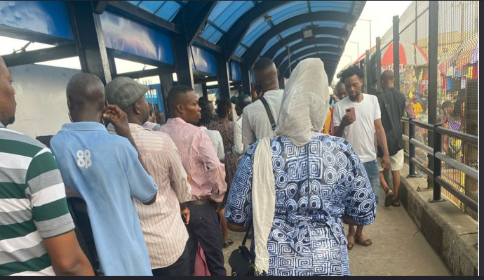 Commuters face a rush for buses at the busy Oshodi BRT terminal in Lagos.