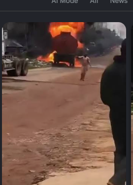 Iwo burning fuel tanker driver moves a burning tanker away from nearby buildings.
