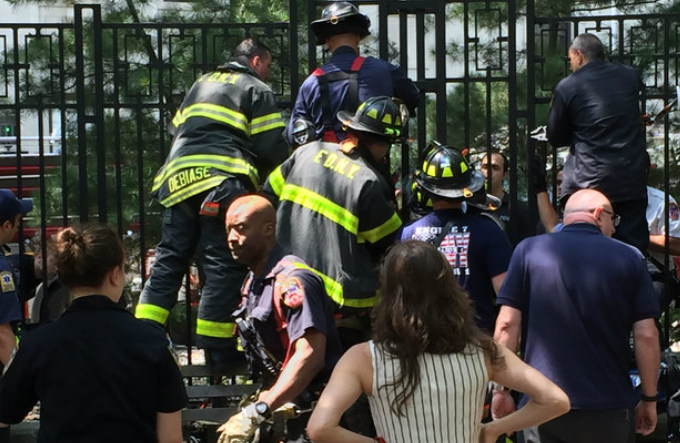 FDNY rescues boy stuck in sidewalk fence