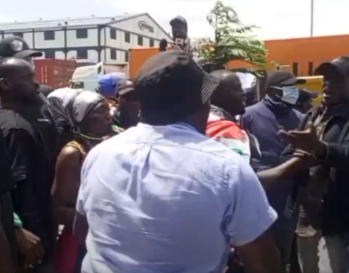 Pro-govt youths protest outside the Standard Group offices in Nairobi.