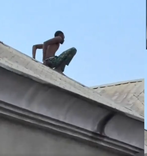 Suspected thief during the Lagos rooftop arrest in Ago Palace.