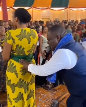Nigerian church video pastor touches wife during a church service