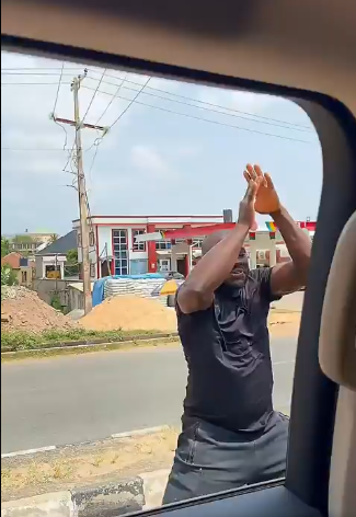 Grassroots enthusiasm peaks as a dedicated supporter runs barefoot near a campaign vehicle ahead of the 2027 elections.